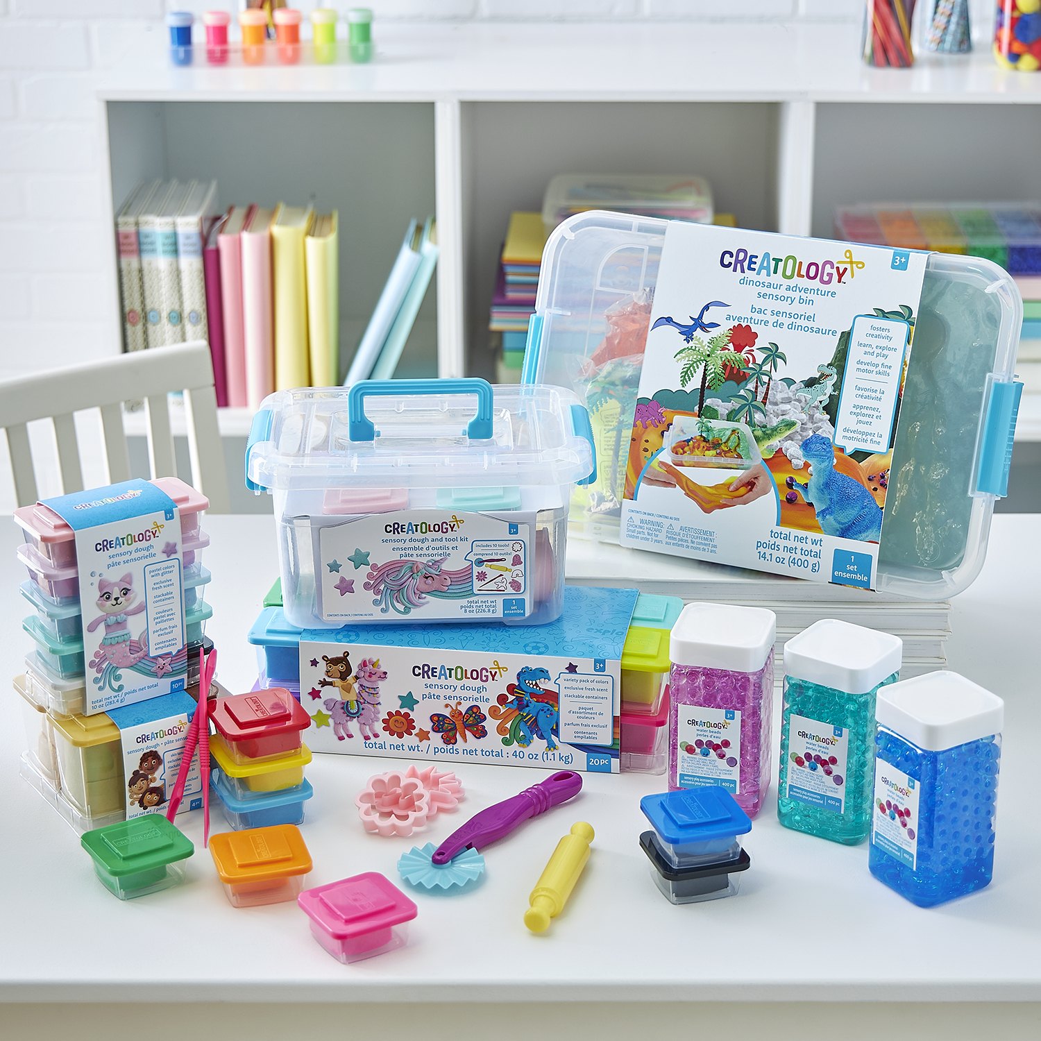 A shelf of Creatology craft storage boxes and supplies